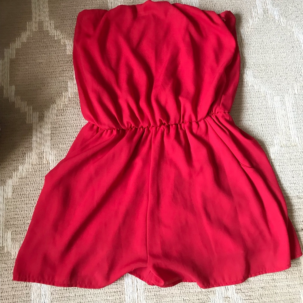 Red shorts strapless romper with pockets.